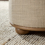 Featuring Bilbury Saxon Sand Ottoman by Four Hands at Amethyst Home. For an extra seat or propped feet, this welcoming ottoman features a subtly tapered shape and a rounded base with oak bun feet beneath. Crafted with soft foam cushioning and upholstered in a poly/wool blend fabric. Overall Dimensions: 22.00"w x 22.00"d x 18.50"h. Amethyst Home provides interior design, new home construction design consulting, vintage area rugs, and lighting in the Seattle metro area.