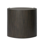 Rich contours bring character to the bedside. A round black-finished oak table has a spacious cubby and a single drawer with metal glides and a bronzed pull Amethyst Home provides interior design, new home construction design consulting, vintage area rugs, and lighting in the Austin metro area.