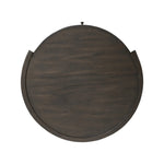 Rich contours bring character to the bedside. A round black-finished oak table has a spacious cubby and a single drawer with metal glides and a bronzed pull Amethyst Home provides interior design, new home construction design consulting, vintage area rugs, and lighting in the Kansas City metro area.