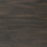 Rich contours bring character to the bedside. A round black-finished oak table has a spacious cubby and a single drawer with metal glides and a bronzed pull Amethyst Home provides interior design, new home construction design consulting, vintage area rugs, and lighting in the Monterey metro area.