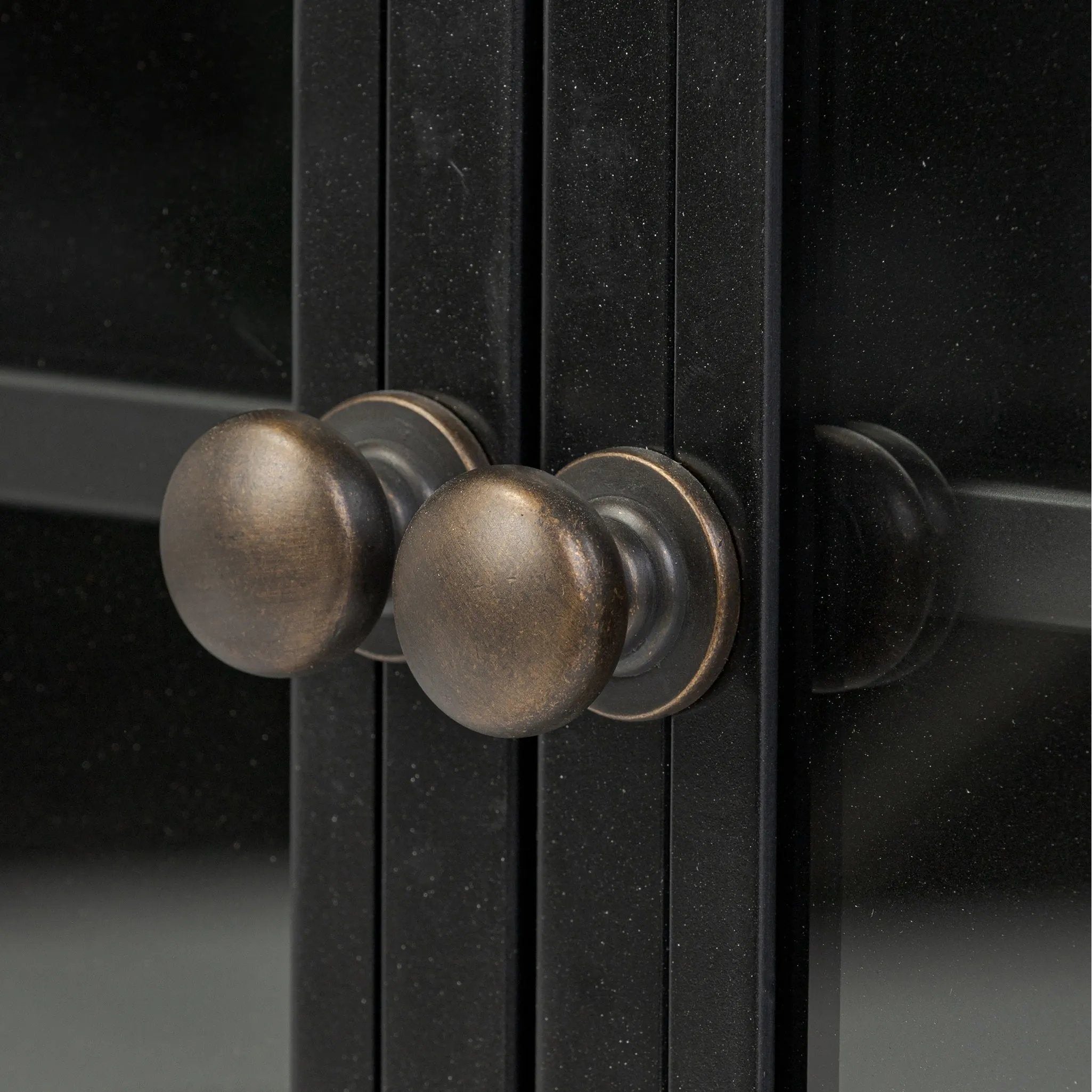 Bring a classic look to media storage with a console of black-finished iron, featuring simple bronzed hardware. Rear cutouts keep cords out of sight Amethyst Home provides interior design, new home construction design consulting, vintage area rugs, and lighting in the Alpharetta metro area.