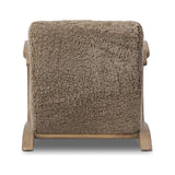 Soft texture and eye-catching contours fuse in this comfort-driven accent chair, pairing a low, luxurious shearling seat and