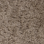 Soft texture and eye-catching contours fuse in this comfort-driven accent chair, pairing a low, luxurious shearling seat and