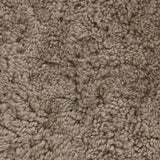 Soft texture and eye-catching contours fuse in this comfort-driven accent chair, pairing a low, luxurious shearling seat and