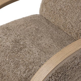 Soft texture and eye-catching contours fuse in this comfort-driven accent chair, pairing a low, luxurious shearling seat and