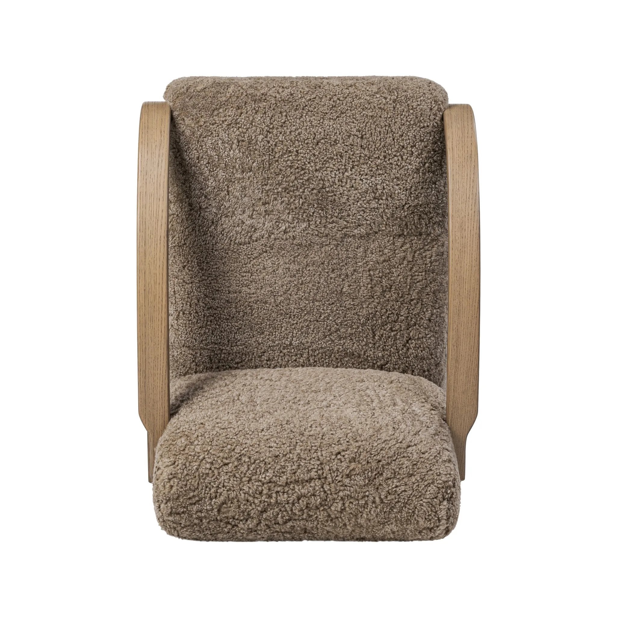 Soft texture and eye-catching contours fuse in this comfort-driven accent chair, pairing a low, luxurious shearling seat and