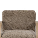 Soft texture and eye-catching contours fuse in this comfort-driven accent chair, pairing a low, luxurious shearling seat and