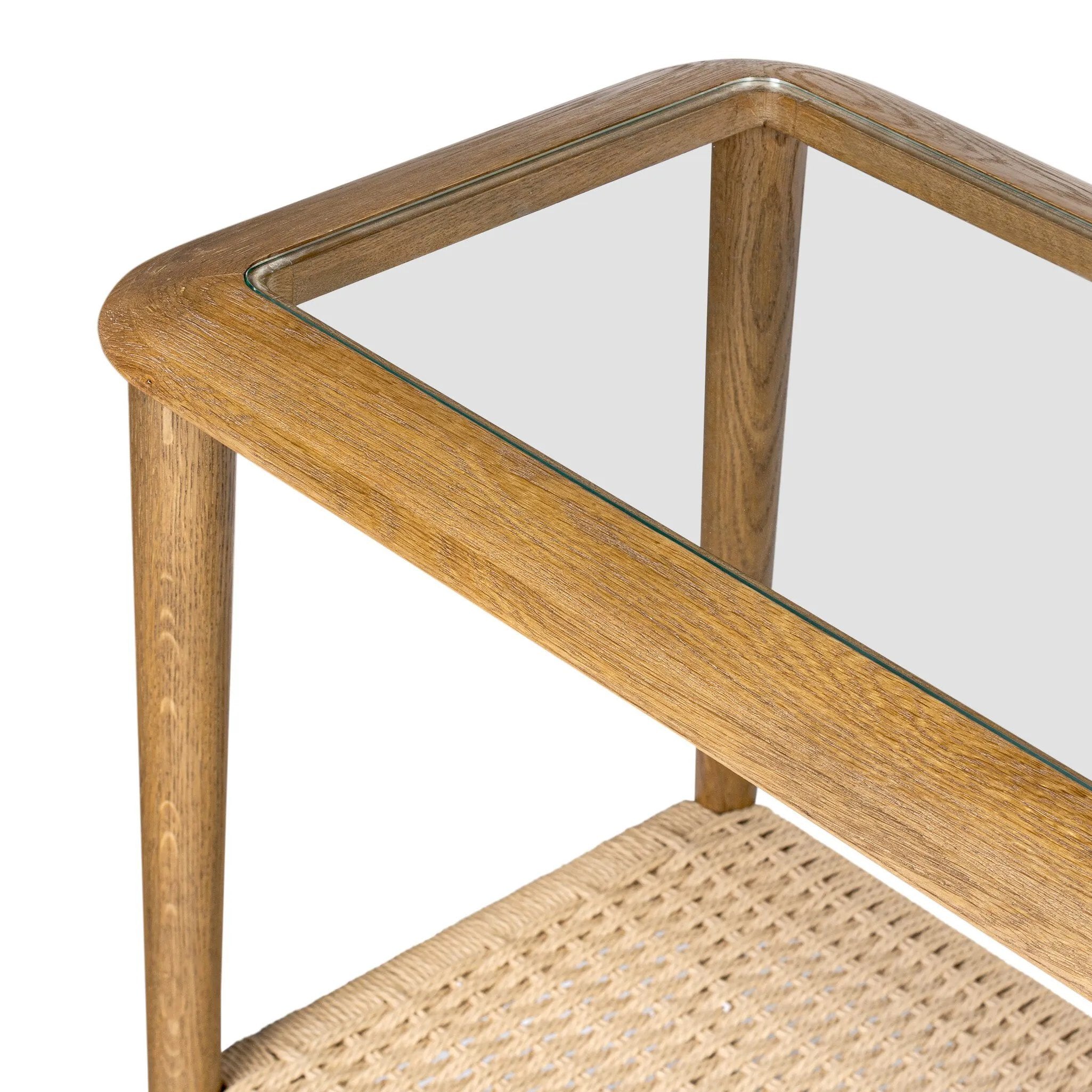 Made from brown oak, woven paper cord and tempered glass, an open-style console works into any space or style with ease, thanks to its beautifully versatile design Amethyst Home provides interior design, new home construction design consulting, vintage area rugs, and lighting in the Charlotte metro area.