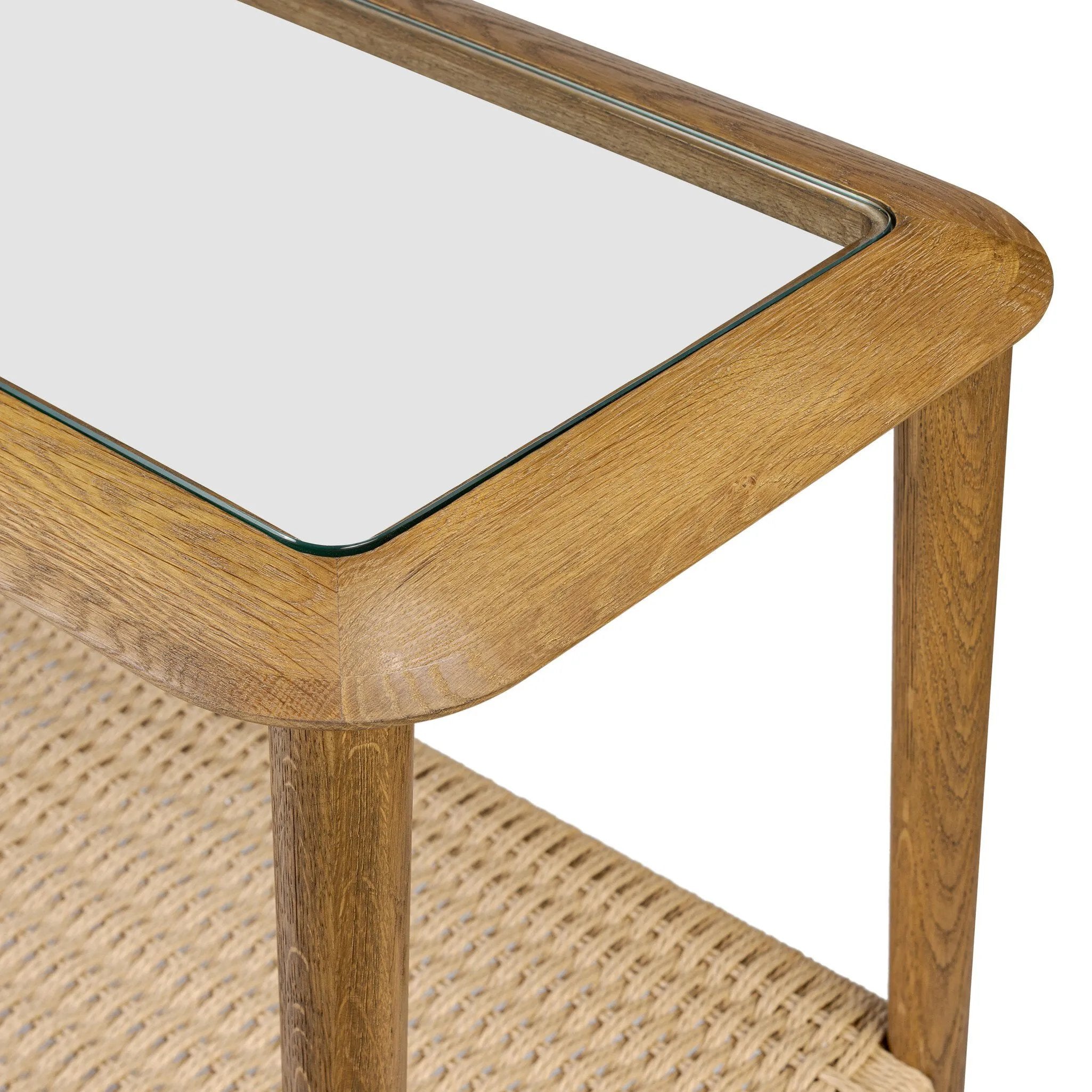 Made from brown oak, woven paper cord and tempered glass, an open-style console works into any space or style with ease, thanks to its beautifully versatile design Amethyst Home provides interior design, new home construction design consulting, vintage area rugs, and lighting in the Dallas metro area.