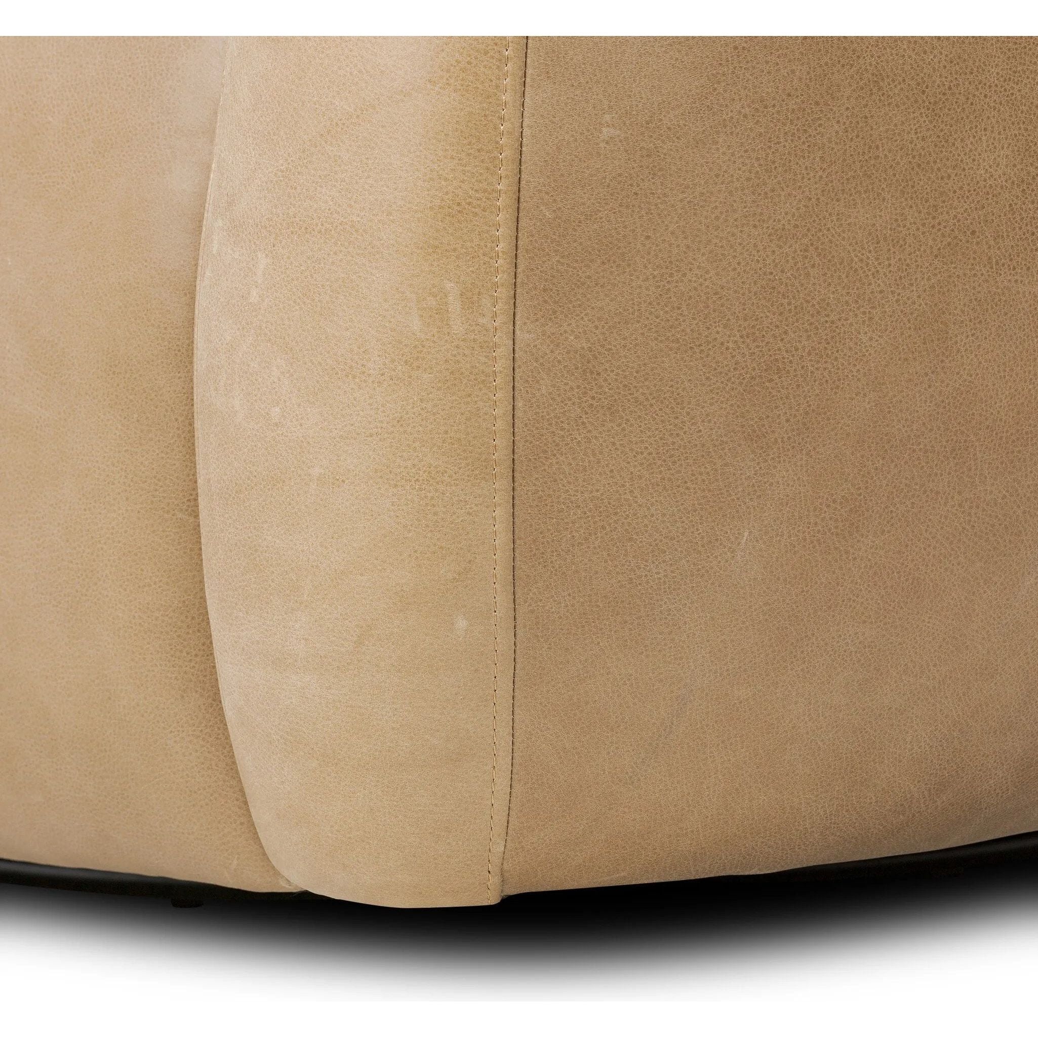 Meet modern comfort. Clean curves, impeccable tailoring and taupe top-grain leather with a pronounced grain bring an elevated, European-inspired look to this swivel chair Amethyst Home provides interior design, new home construction design consulting, vintage area rugs, and lighting in the Austin metro area.