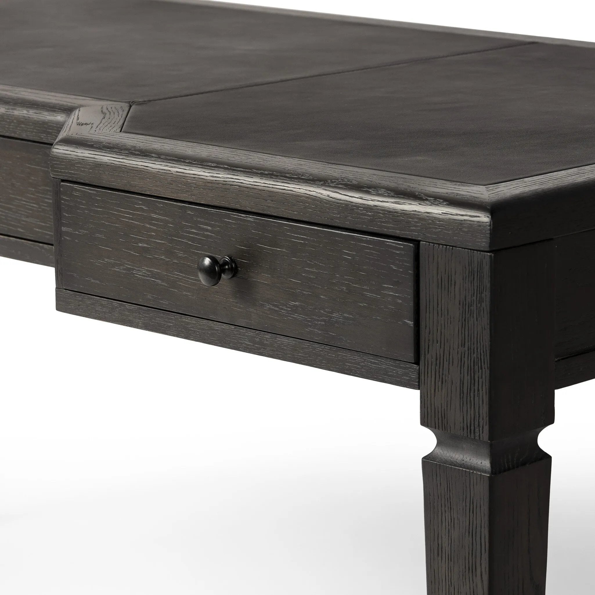 Featuring Claude Distressed Black Oak Veneer Desk by Four Hands at Amethyst Home. This refreshed directoire-style desk pairs a 100% top-grain leather inset top with a unique reverse breakfront and recessed center drawer. Finished in distressed black oak, it offers the workspace a classic yet updated feel.
Overall Dimensions: 28.0" L x 68.0 " W x 30.0" H
Mat. Amethyst Home provides interior design, new home construction design consulting, vintage area rugs, and lighting in the Nashville metro area.