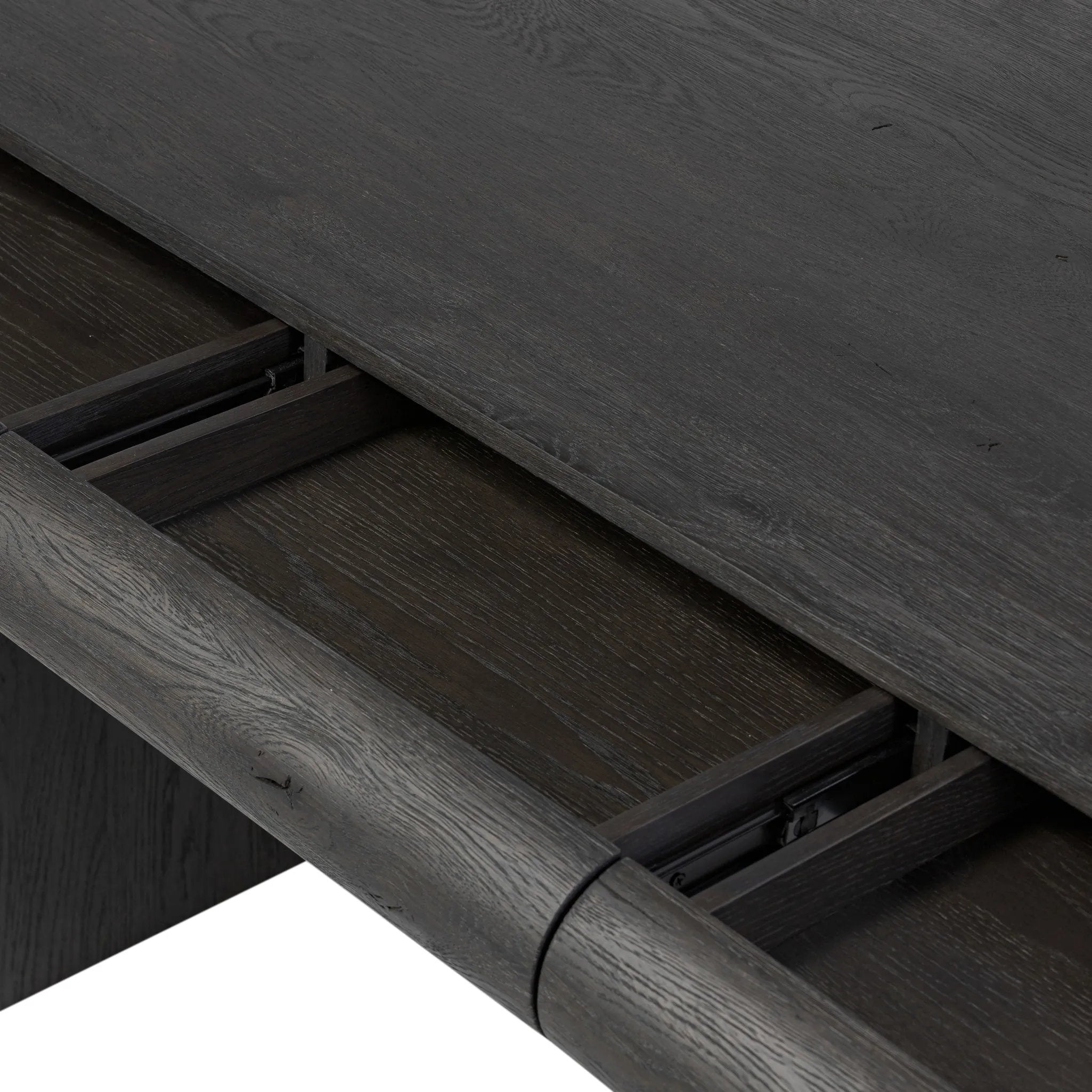 Bring a beautifully contoured look to your workspace with a desk inspired by Italian postmodernism. Connected by iron brackets, a dual-panel base supports a spacious tabletop of worn black oak, crafting a float-like look. Four drawers keep frequently used items within reach Amethyst Home provides interior design, new home construction design consulting, vintage area rugs, and lighting in the Park City metro area.