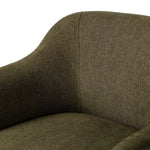 A Swedish Gustavian inspired captain chair gets a modern update with high arms and an exposed frame. The tight cushion in olive fabric paired with buff parawood lends a luxe natural feel Amethyst Home provides interior design, new home construction design consulting, vintage area rugs, and lighting in the Kansas City metro area.