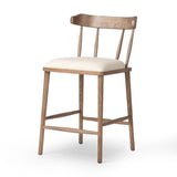 Featuring Colter Antwerp Natural Counter Stool by Four Hands at Amethyst Home. Made from solid ash with an amber finish, this versatile counter stool pairs an airy back with tapered spindles, for a simple, inviting look. A fixed upholstered seat of high-performance fabric adds a smart, comfortable touch. Steam regularly for a crisper fabric look. Perfo. Amethyst Home provides interior design, new home construction design consulting, vintage area rugs, and lighting in the Salt Lake City metro area.