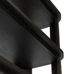 Unexpected contours give this bookcase its warm, modern vibe. Crafted oak veneer with a worn black finish, rounded legs are inset from the shelves with a plinth-like effect Amethyst Home provides interior design, new home construction design consulting, vintage area rugs, and lighting in the Kansas City metro area.