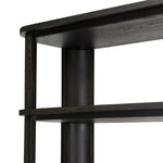 Unexpected contours give this bookcase its warm, modern vibe. Crafted oak veneer with a worn black finish, rounded legs are inset from the shelves with a plinth-like effect Amethyst Home provides interior design, new home construction design consulting, vintage area rugs, and lighting in the Winter Garden metro area.