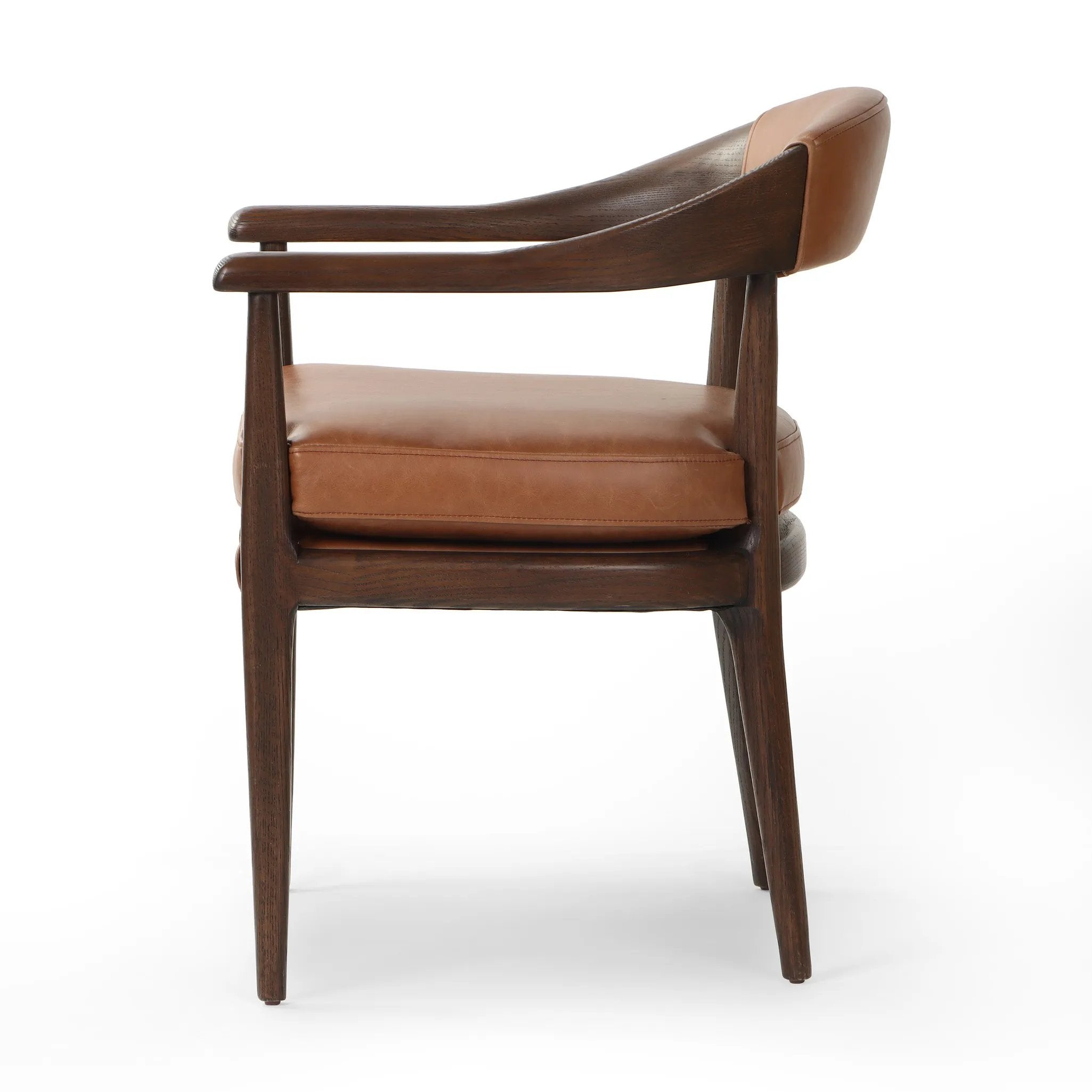 Featuring Dane Sonoma Chestnut Dining Chair by Four Hands at Amethyst Home. Indulge in the refined elegance of the Dane Sonoma Chestnut Dining Chair. With its classic design and luxurious chestnut finish, this dining chair is the perfect addition to any upscale dining room. Its sturdy construction ensures both style and comfort, making every meal a lavish exp. Amethyst Home provides interior design, new home construction design consulting, vintage area rugs, and lighting in the Houston metro area.