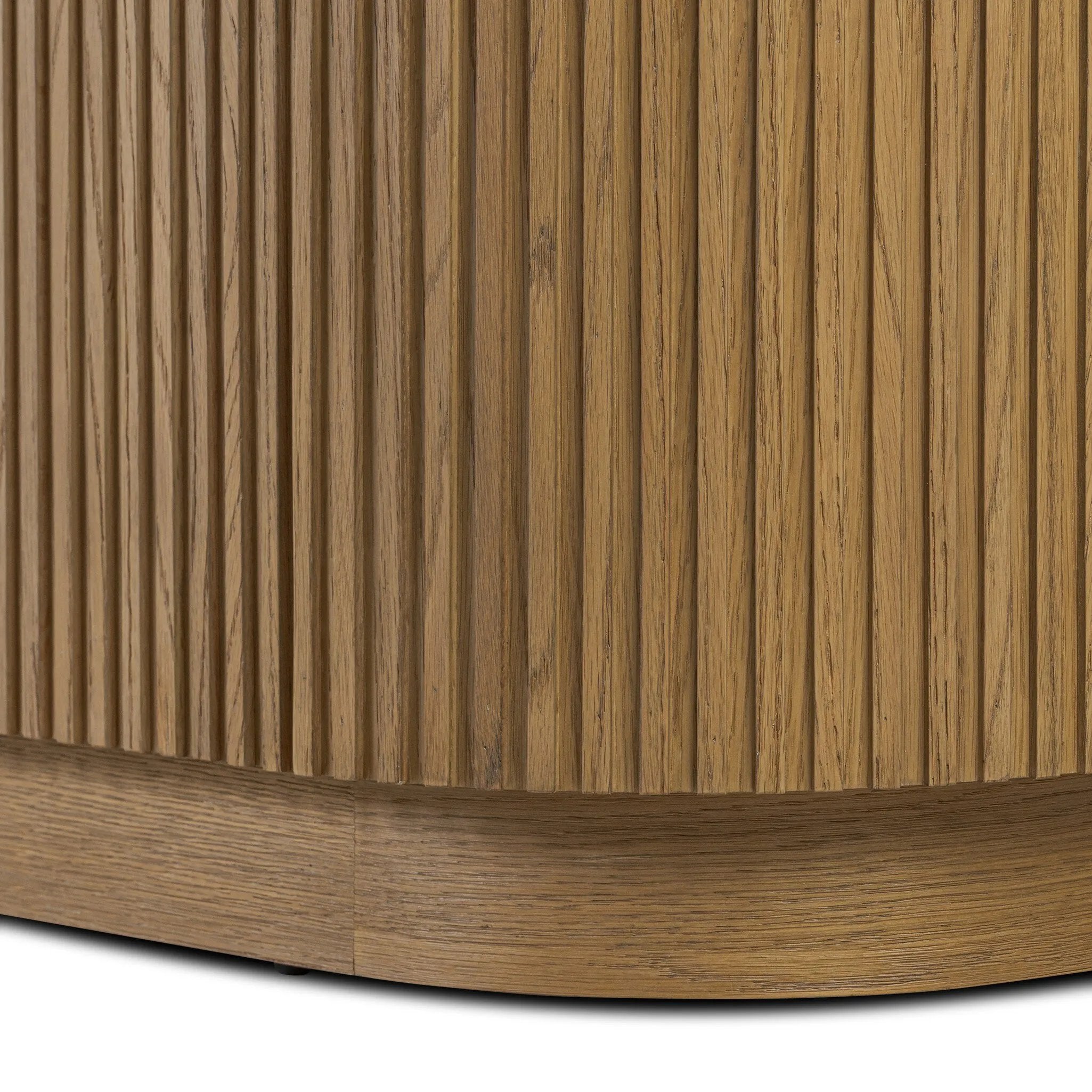 Crafted from desert oak solids and veneers with a plinth-style base, rounded sides and linear reeding, this sideboard exudes midcentury vibes. Fully finished interior and shelves for quality detailing inside and out Amethyst Home provides interior design, new home construction design consulting, vintage area rugs, and lighting in the Kansas City metro area.