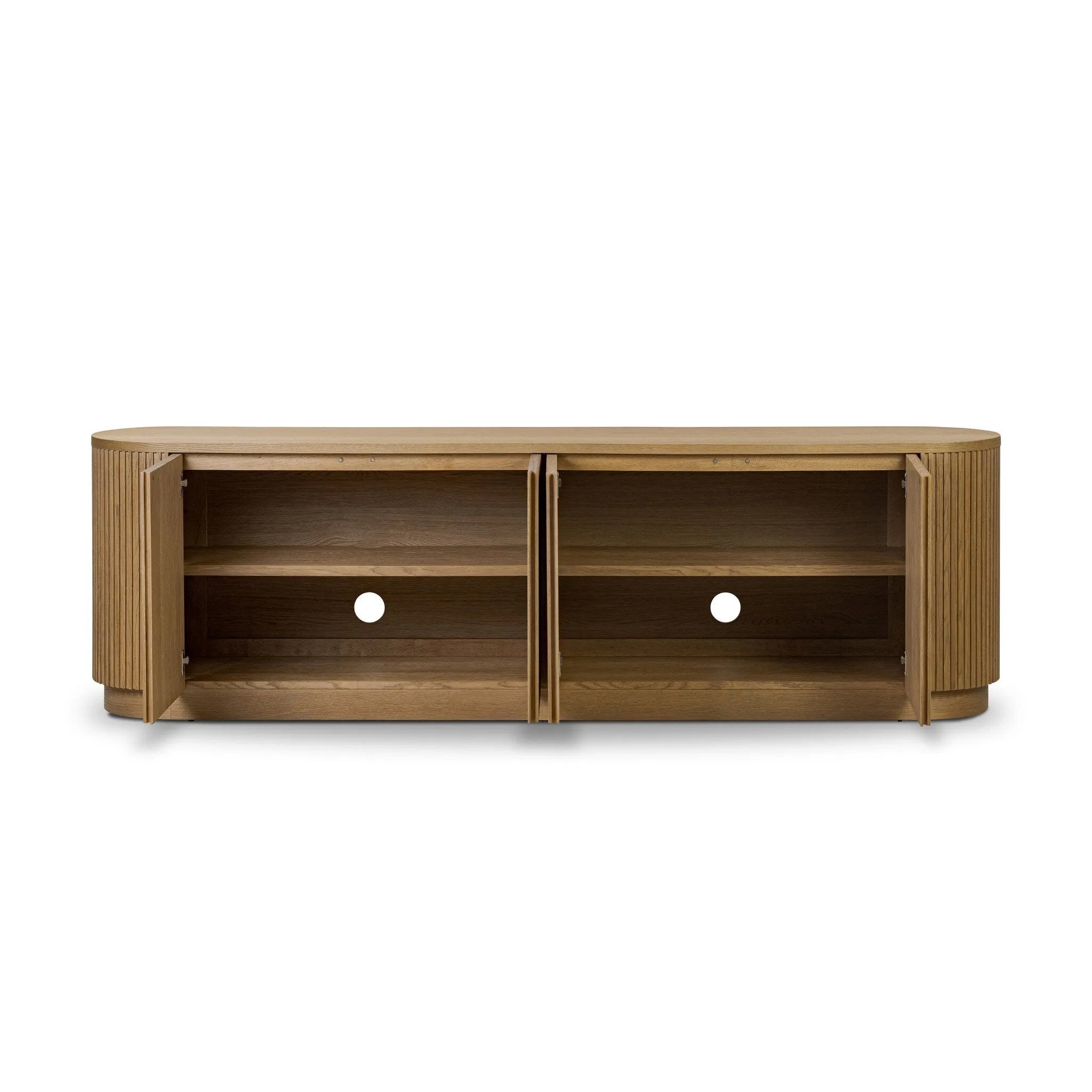 Crafted from desert oak solids and veneers with a plinth-style base, rounded sides and linear reeding, this sideboard exudes midcentury vibes. Fully finished interior and shelves for quality detailing inside and out Amethyst Home provides interior design, new home construction design consulting, vintage area rugs, and lighting in the Los Angeles metro area.