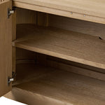 Crafted from desert oak solids and veneers with a plinth-style base, rounded sides and linear reeding, this sideboard exudes midcentury vibes.  Fully finished interior and shelves for quality detailing inside and out Amethyst Home provides interior design, new home construction design consulting, vintage area rugs, and lighting in the Miami metro area.