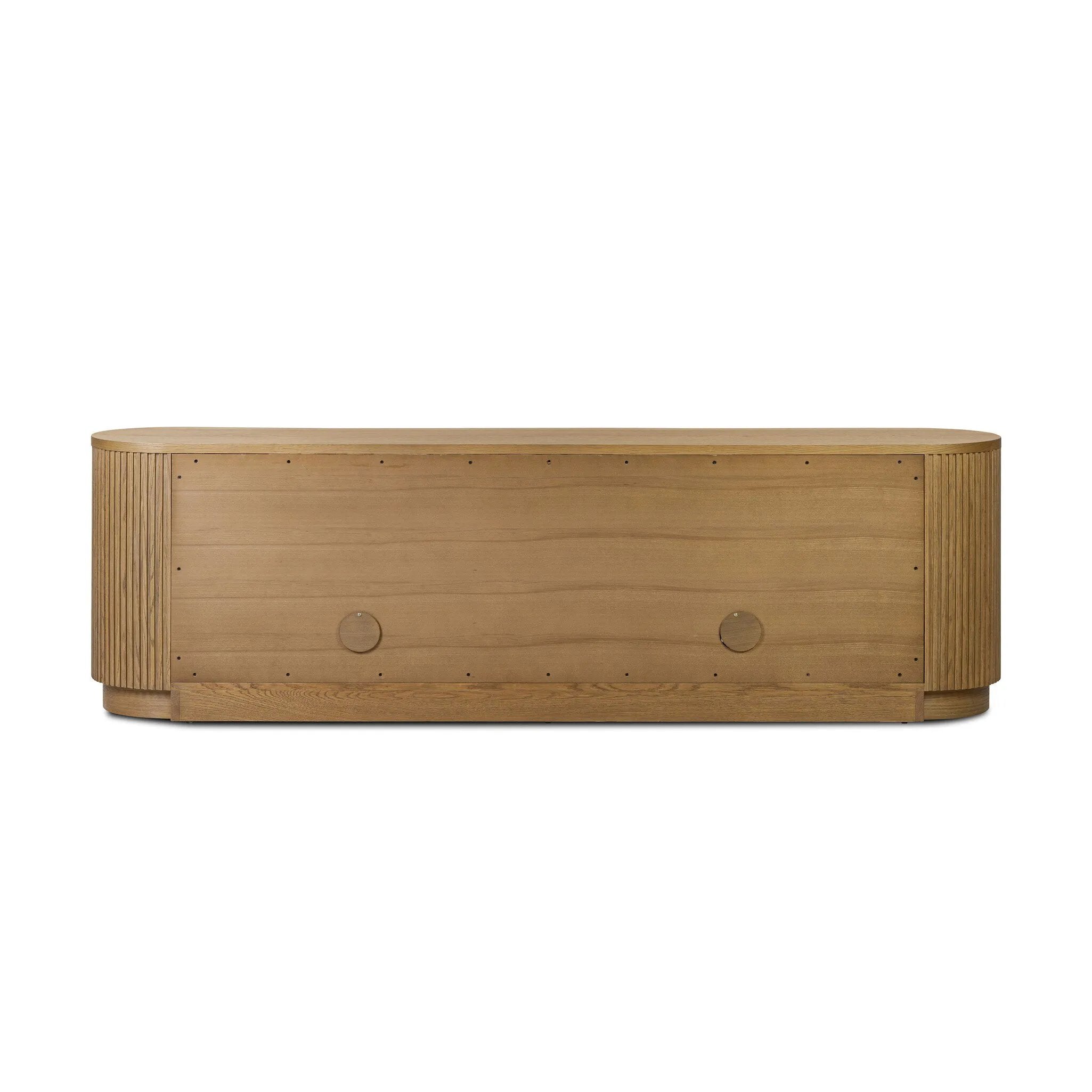 Crafted from desert oak solids and veneers with a plinth-style base, rounded sides and linear reeding, this sideboard exudes midcentury vibes. Fully finished interior and shelves for quality detailing inside and out Amethyst Home provides interior design, new home construction design consulting, vintage area rugs, and lighting in the Monterey metro area.