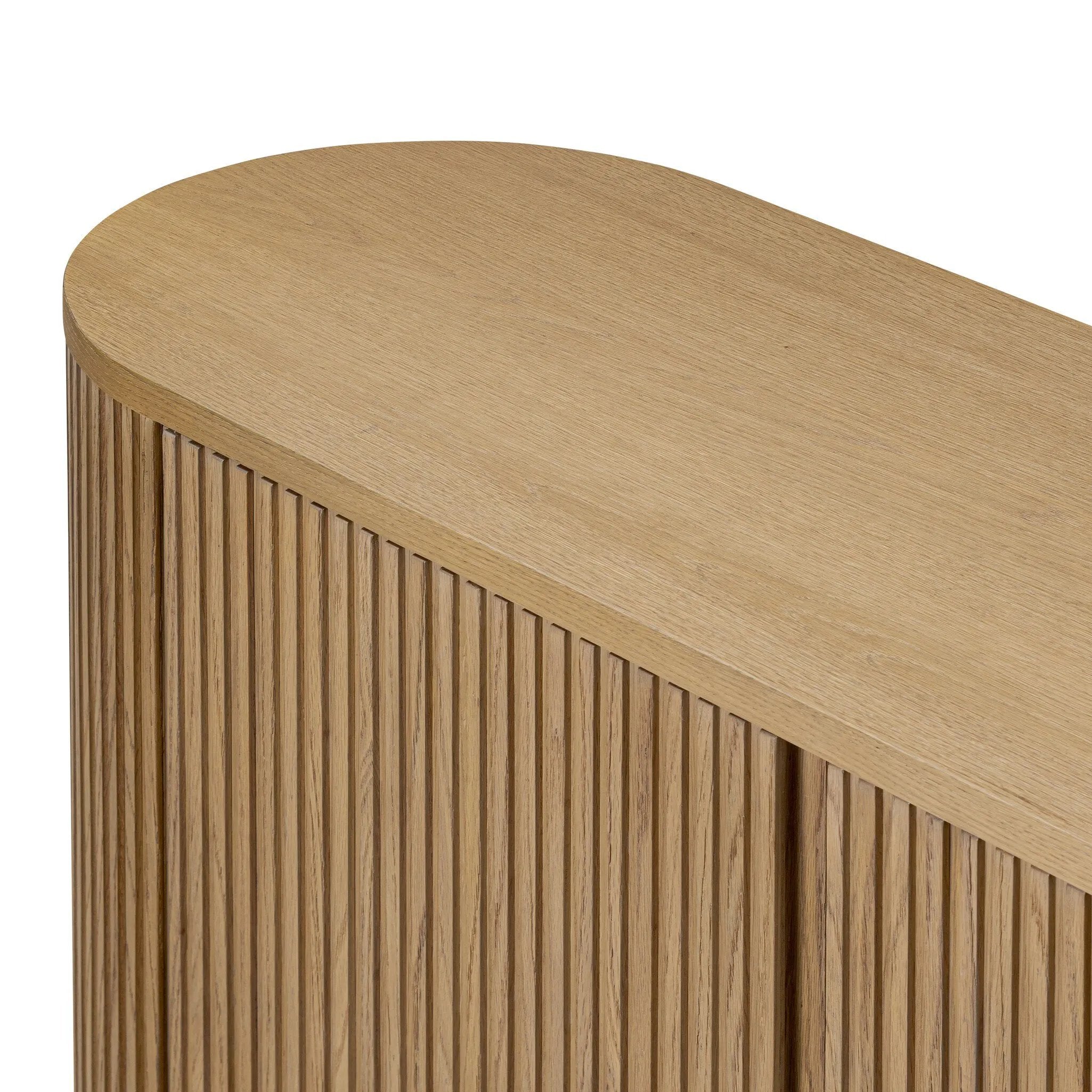 Crafted from desert oak solids and veneers with a plinth-style base, rounded sides and linear reeding, this sideboard exudes midcentury vibes. Fully finished interior and shelves for quality detailing inside and out Amethyst Home provides interior design, new home construction design consulting, vintage area rugs, and lighting in the Park City metro area.