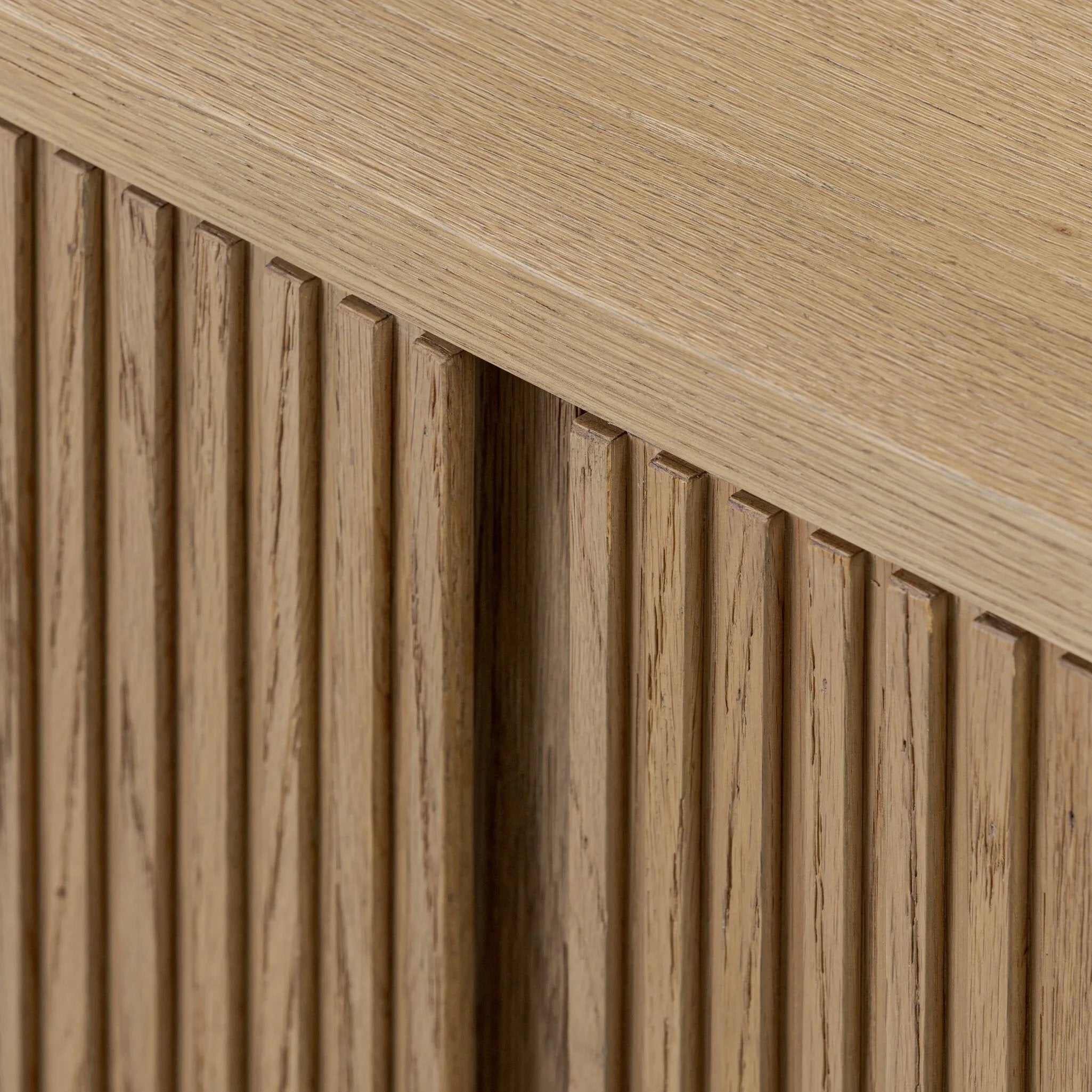Crafted from desert oak solids and veneers with a plinth-style base, rounded sides and linear reeding, this sideboard exudes midcentury vibes. Fully finished interior and shelves for quality detailing inside and out Amethyst Home provides interior design, new home construction design consulting, vintage area rugs, and lighting in the Portland metro area.
