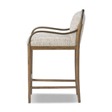 A tribute to traditional artistry and found pieces, this bar stool fluidly combines ash and burnished brass to frame a comfortable S-spring seat. Finished in heavy boucle-like upholstery that features a subtle linear pattern for added depth — creating a luxe, inviting feel. A design collaboration by Amber Lewis and Four Hands. Amethyst Home provides interior design, new home construction design consulting, vintage area rugs, and lighting in the Los Angeles metro area.