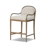 A tribute to traditional artistry and found pieces, this bar stool fluidly combines ash and burnished brass to frame a comfortable S-spring seat. Finished in heavy boucle-like upholstery that features a subtle linear pattern for added depth — creating a luxe, inviting feel. A design collaboration by Amber Lewis and Four Hands. Amethyst Home provides interior design, new home construction design consulting, vintage area rugs, and lighting in the Nashville metro area.