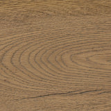 Slightly scooped top-grain leather tufting is bridged with metal bars in brushed brass for modern detailing. Aged smoked oak