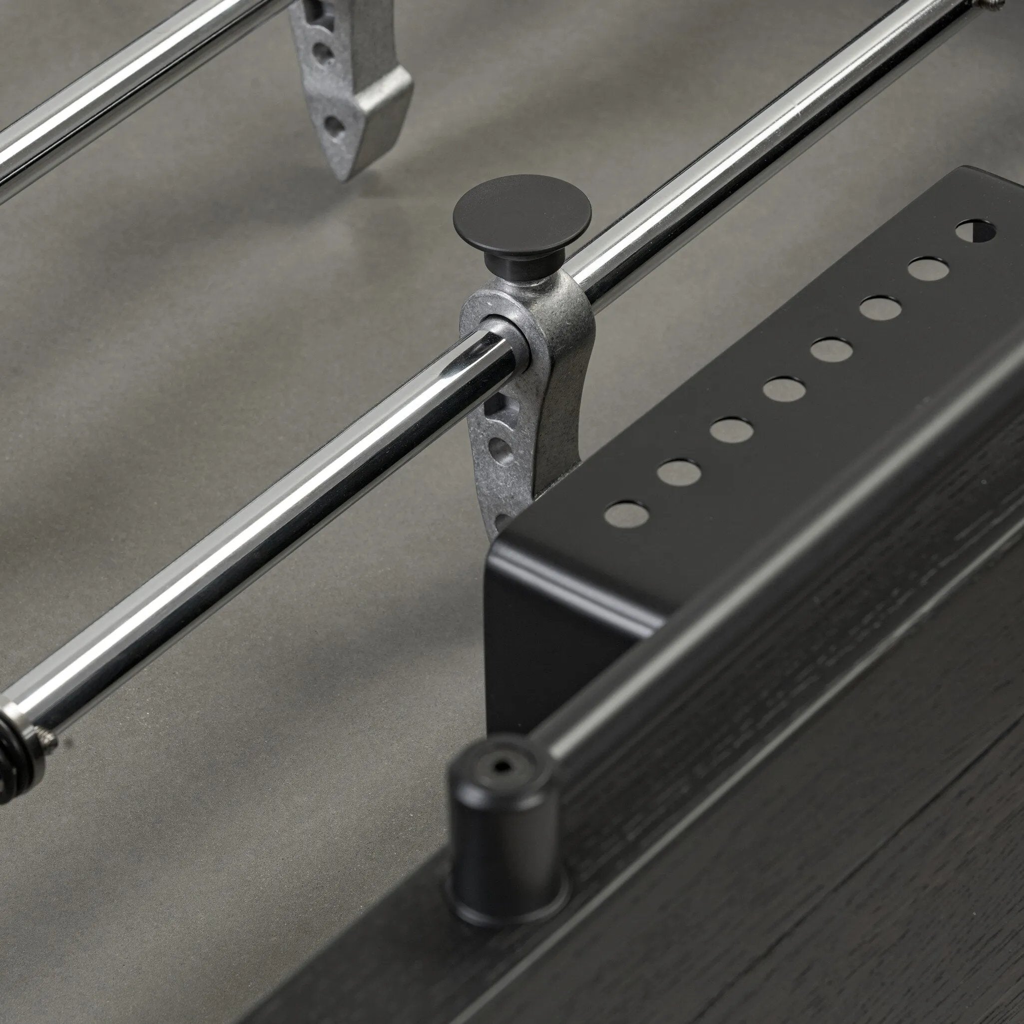 Streamlined for fun. This foosball table features a concrete playing surface and distinctly detailed players in cast aluminum. Rounded square wooden handles and cylindrical metal score counters tie together the sleek, industrial look of this foosball table, finished with tapered cast aluminum legs. Amethyst Home provides interior design, new home construction design consulting, vintage area rugs, and lighting in the Monterey metro area.