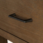 A kitchen island and waterfall dining table in one. Crafted from oak, the island system features two large shelves and three drawers on each side, all  topped with by warm grey marble. The pullout table extends and fits inside the frame with ease Amethyst Home provides interior design, new home construction design consulting, vintage area rugs, and lighting in the Alpharetta metro area.