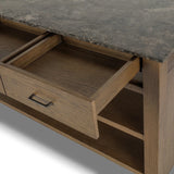 A kitchen island and waterfall dining table in one. Crafted from oak, the island system features two large shelves and three drawers on each side, all topped with by warm grey marble. The pullout table extends and fits inside the frame with ease Amethyst Home provides interior design, new home construction design consulting, vintage area rugs, and lighting in the Park City metro area.