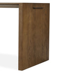 A kitchen island and waterfall dining table in one. Crafted from oak, the island system features two large shelves and three drawers on each side, all  topped with by warm grey marble. The pullout table extends and fits inside the frame with ease Amethyst Home provides interior design, new home construction design consulting, vintage area rugs, and lighting in the Salt Lake City metro area.