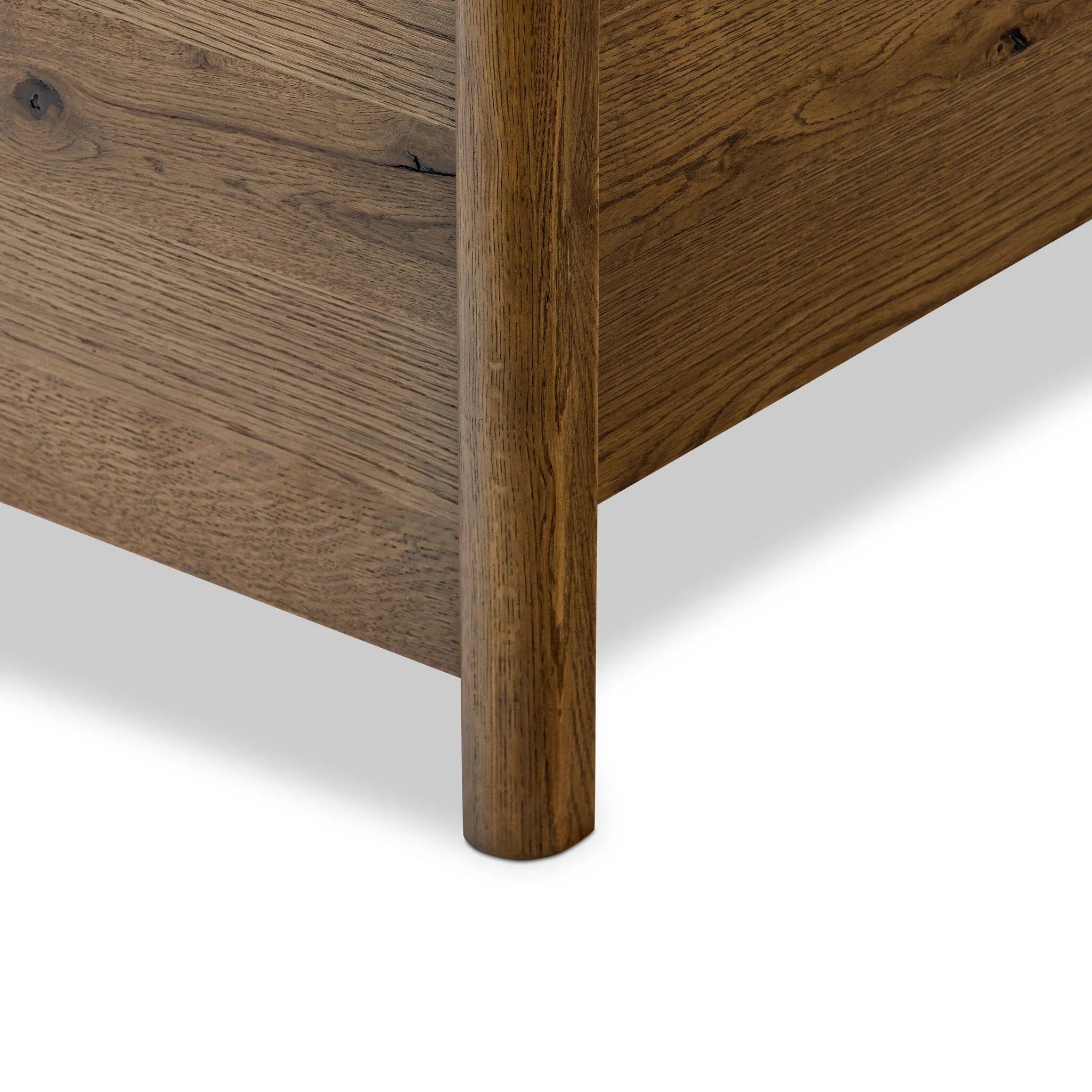 A heritage-inspired bed features soft curves and intricate carving along a rustic oak frame. A light, linen-upholstered headboard brings a touch a warmth to bedroom styling. Performance fabrics are specially created to withstand spills, stains, high traffic and wear, ensuring long-term comfort and unmatched durability Amethyst Home provides interior design, new home construction design consulting, vintage area rugs, and lighting in the Dallas metro area.