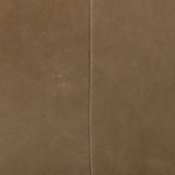 A modernized midcentury silhouette meets the traditional Chesterfield sofa, all in a compact profile perfect for smaller spaces. Top-grain leather in a tan hue, button tufting and a smooth touch bring deep comfort to lounging Amethyst Home provides interior design, new home construction design consulting, vintage area rugs, and lighting in the Alpharetta metro area.