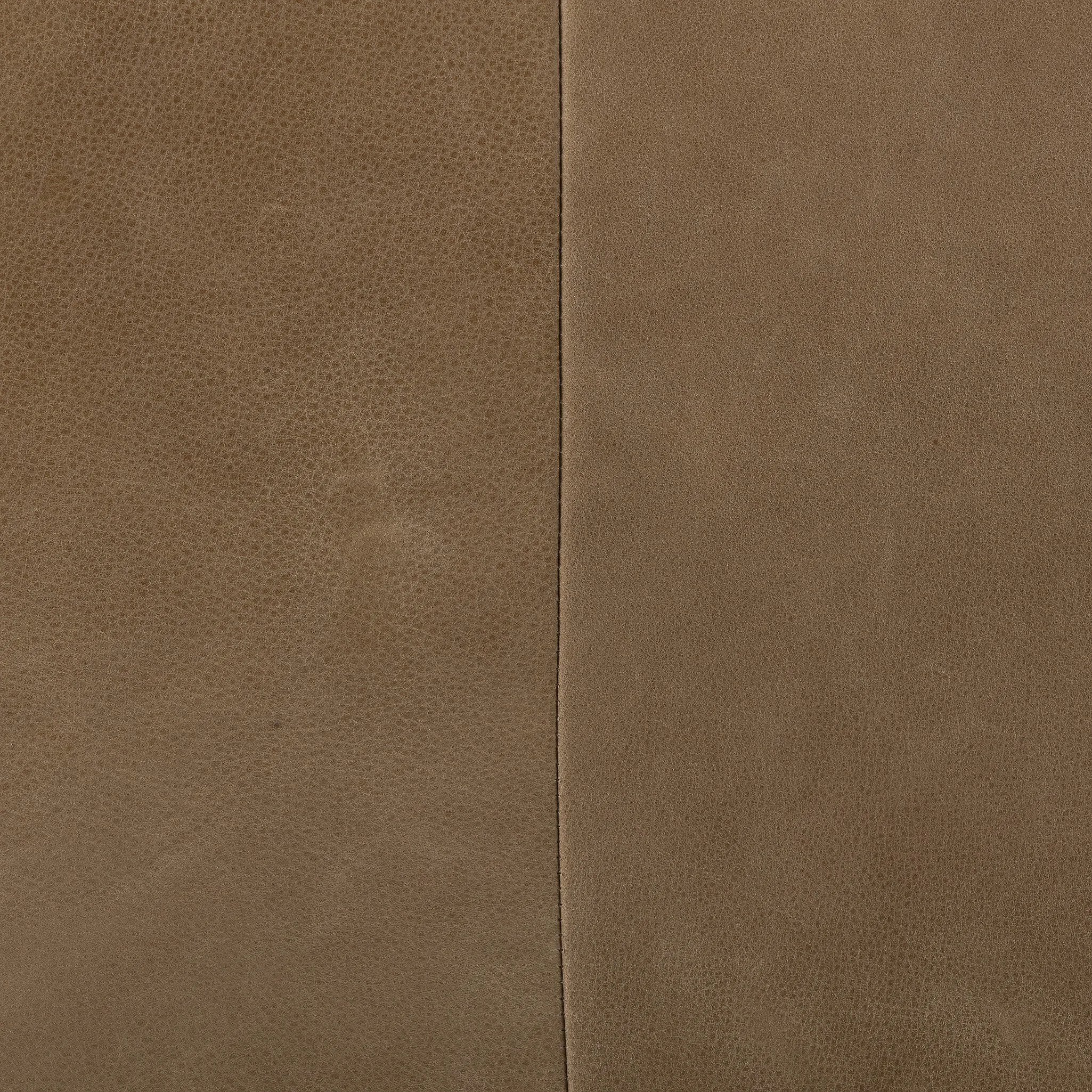 A modernized midcentury silhouette meets the traditional Chesterfield sofa, all in a compact profile perfect for smaller spaces. Top-grain leather in a tan hue, button tufting and a smooth touch bring deep comfort to lounging Amethyst Home provides interior design, new home construction design consulting, vintage area rugs, and lighting in the Alpharetta metro area.