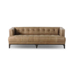 A modernized midcentury silhouette meets the traditional Chesterfield sofa, all in a compact profile perfect for smaller spaces. Top-grain leather in a tan hue, button tufting and a smooth touch bring deep comfort to lounging Amethyst Home provides interior design, new home construction design consulting, vintage area rugs, and lighting in the Des Moines metro area.
