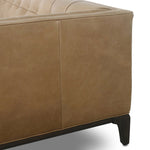 A modernized midcentury silhouette meets the traditional Chesterfield sofa, all in a compact profile perfect for smaller spaces. Top-grain leather in a tan hue, button tufting and a smooth touch bring deep comfort to lounging Amethyst Home provides interior design, new home construction design consulting, vintage area rugs, and lighting in the Miami metro area.