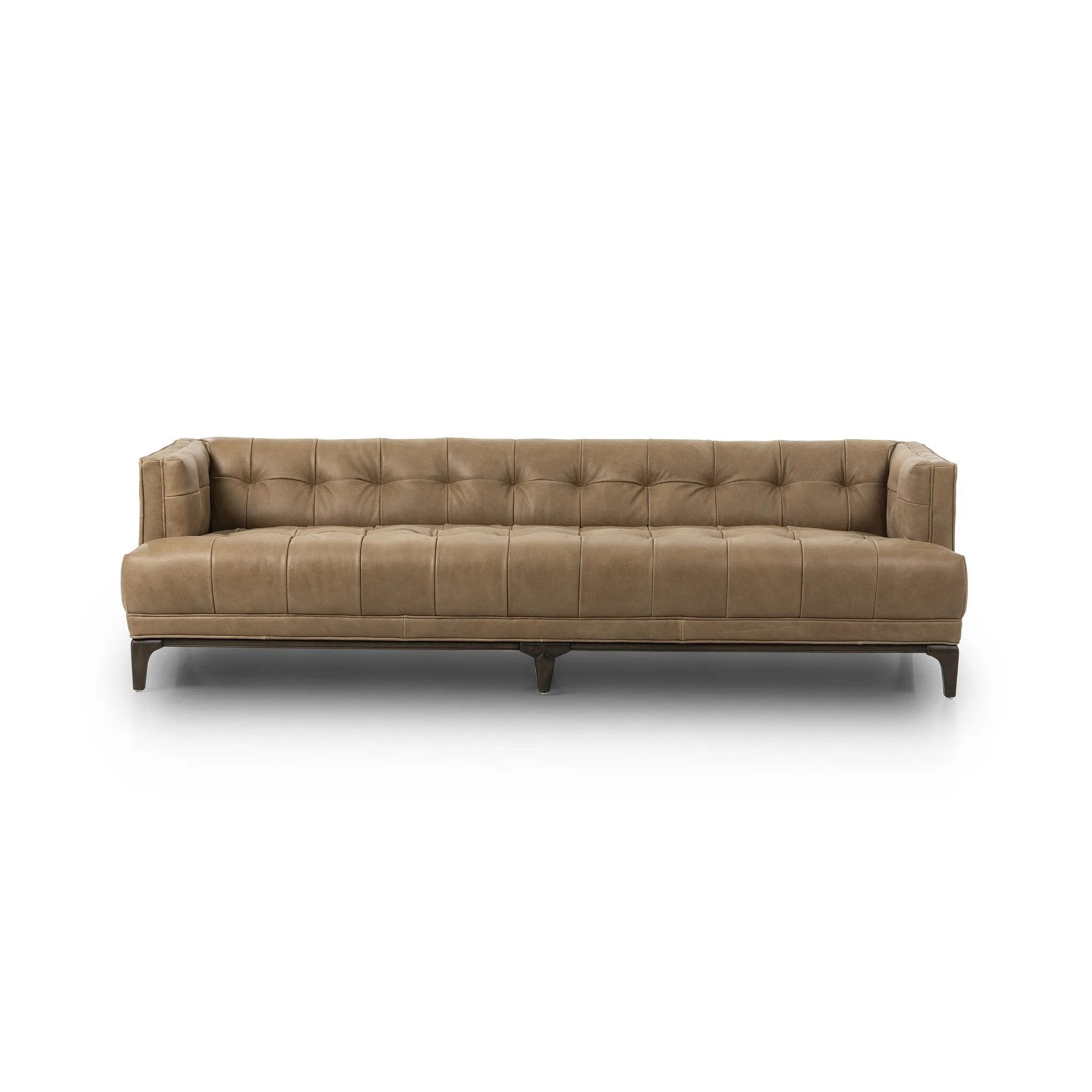 A modernized midcentury silhouette meets the traditional Chesterfield sofa, all in a compact profile perfect for smaller spaces. Top-grain leather in a tan hue, button tufting and a smooth touch bring deep comfort to lounging Amethyst Home provides interior design, new home construction design consulting, vintage area rugs, and lighting in the Newport Beach metro area.