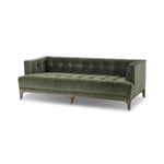 A modernized midcentury silhouette meets the traditional Chesterfield sofa, all in a compact profile perfect for smaller spaces. Smooth velvet in an olive hue, button tufting and a soft touch bring deep comfort to lounging Amethyst Home provides interior design, new home construction design consulting, vintage area rugs, and lighting in the Monterey metro area.