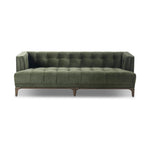 A modernized midcentury silhouette meets the traditional Chesterfield sofa, all in a compact profile perfect for smaller spaces. Smooth velvet in an olive hue, button tufting and a soft touch bring deep comfort to lounging Amethyst Home provides interior design, new home construction design consulting, vintage area rugs, and lighting in the Nashville metro area.
