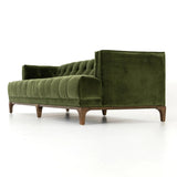 A modernized midcentury silhouette meets the traditional Chesterfield sofa, all in a compact profile perfect for smaller spaces. Smooth velvet in an olive hue, button tufting and a soft touch bring deep comfort to lounging Amethyst Home provides interior design, new home construction design consulting, vintage area rugs, and lighting in the San Diego metro area.