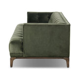 A modernized midcentury silhouette meets the traditional Chesterfield sofa, all in a compact profile perfect for smaller spaces. Smooth velvet in an olive hue, button tufting and a soft touch bring deep comfort to lounging Amethyst Home provides interior design, new home construction design consulting, vintage area rugs, and lighting in the Winter Garden metro area.