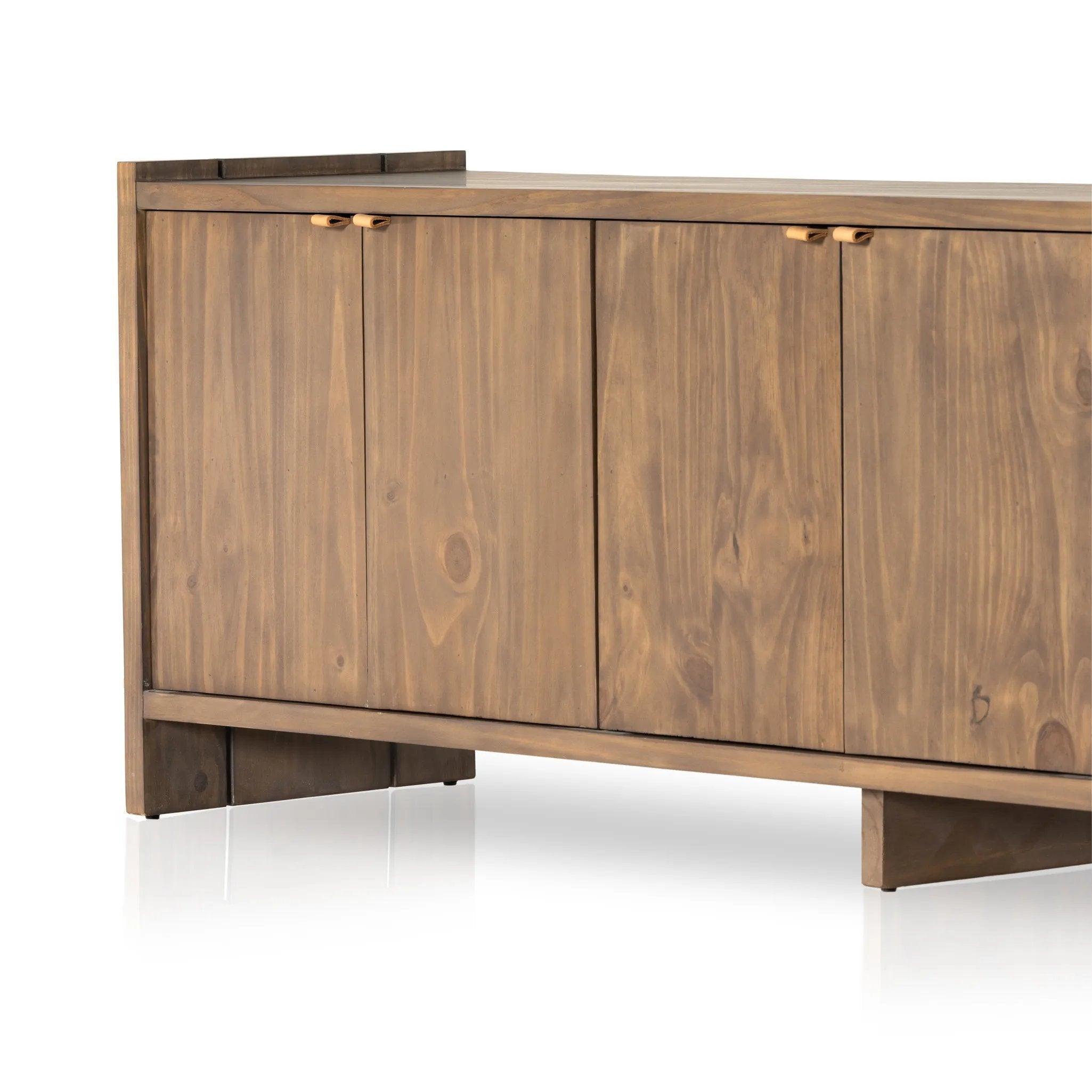 Featuring Etro Tawny Pine Media Console by Four Hands at Amethyst Home. Inspired by retro European design, a character-rich media console is made from solid pine, with mortise and tenon joinery spanning its sides. Door pulls of top-grain leather add a textural finishing touch, while three rear cutouts keep cords out of sight.Overall Dimensions: 78.00"w x 18.00". Amethyst Home provides interior design, new home construction design consulting, vintage area rugs, and lighting in the Miami metro area.