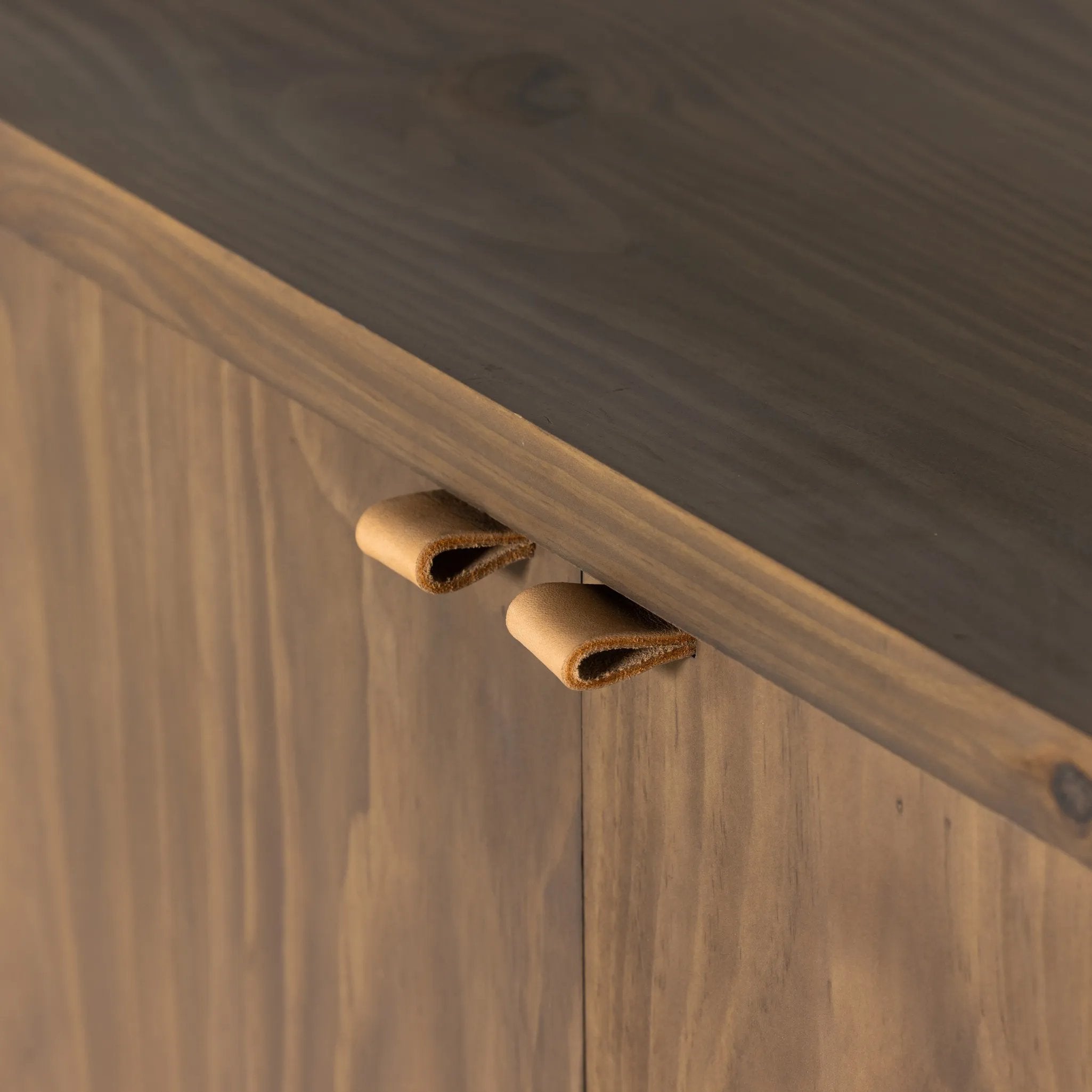 Featuring Etro Tawny Pine Media Console by Four Hands at Amethyst Home. Inspired by retro European design, a character-rich media console is made from solid pine, with mortise and tenon joinery spanning its sides. Door pulls of top-grain leather add a textural finishing touch, while three rear cutouts keep cords out of sight.Overall Dimensions: 78.00"w. Amethyst Home provides interior design, new home construction design consulting, vintage area rugs, and lighting in the Salt Lake City metro area.