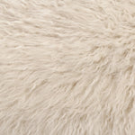 A textural take on a timeless silhouette. Hammered iron frames a squared seat and bolster back upholstered in off-white Mongolian fur Amethyst Home provides interior design, new home construction design consulting, vintage area rugs, and lighting in the Tampa metro area.