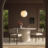 Mixed materials at their finest. Brown parawood forms a slight, simple frame for squared seating of neutral performance-grade upholstery. Charcoal top-grain leather backing takes this modern-minded dining chair to the next level Amethyst Home provides interior design, new home construction design consulting, vintage area rugs, and lighting in the San Diego metro area.