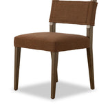 Mixed materials at their finest. Brown parawood forms a slight, simple frame for squared seating of neutral performance-grade upholstery. Charcoal top-grain leather backing takes this modern-minded dining chair to the next level Amethyst Home provides interior design, new home construction design consulting, vintage area rugs, and lighting in the Boston metro area.