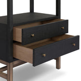 Woven black raffia drawers offer closed storage and a texture-driven take on book shelving. Antique brass-finished hardware adds a touch of vintage detailing, all framed within solid mahogany Amethyst Home provides interior design, new home construction design consulting, vintage area rugs, and lighting in the Kansas City metro area.